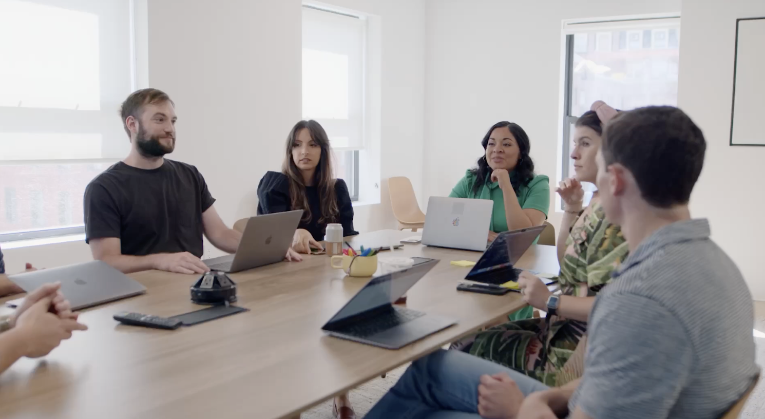 Biobot Analytics team collaborating around a conference table